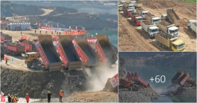 Witness the awe-inspiring sight of a river being traversed by a continuous flow of dump trucks